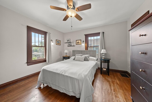 1480 Lincoln Rd, Columbus, OH 43212 - bedroom with multiple windows, wood finished floors, and ceiling fan