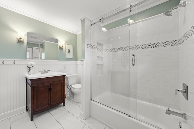 1480 Lincoln Rd, Columbus, OH 43212 - full bathroom featuring marble look tile flooring, shower / bath combination with glass door, vanity, wainscoting, and ornamental molding