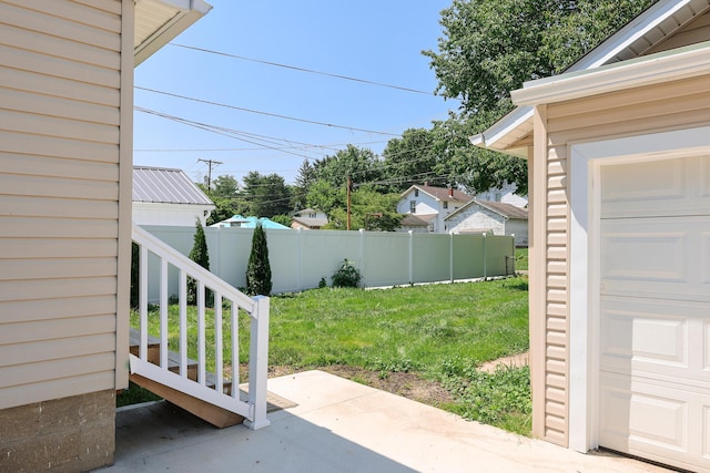 214 Moull St, Newark, OH 43055 - fenced backyard featuring a garage and a patio area