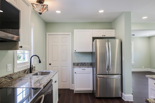 214 Moull St, Newark, OH 43055 - kitchen with appliances with stainless steel finishes, dark wood finished floors, light stone counters, white cabinetry, and recessed lighting
