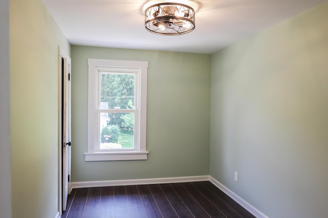 214 Moull St, Newark, OH 43055 - spare room featuring a chandelier and dark wood-type flooring