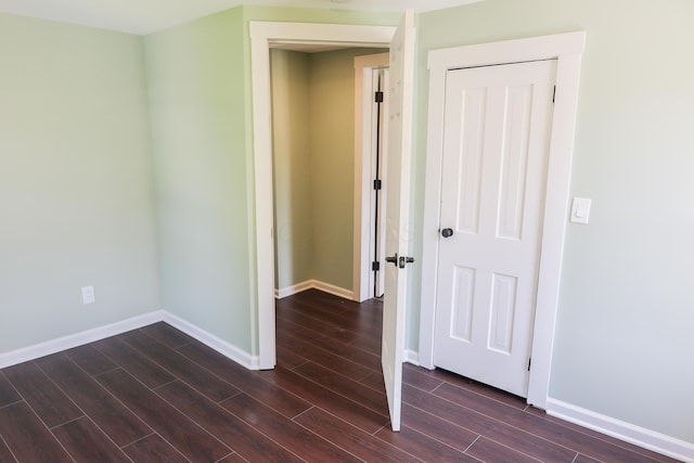 214 Moull St, Newark, OH 43055 - spare room with dark wood-type flooring and baseboards