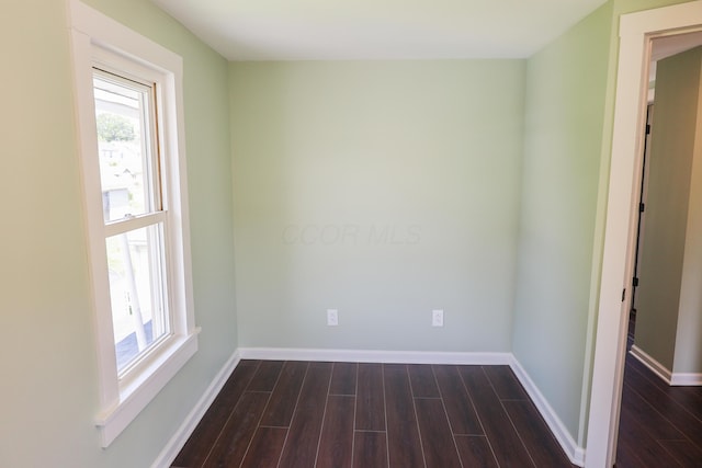 214 Moull St, Newark, OH 43055 - empty room featuring healthy amount of natural light and dark wood-style flooring