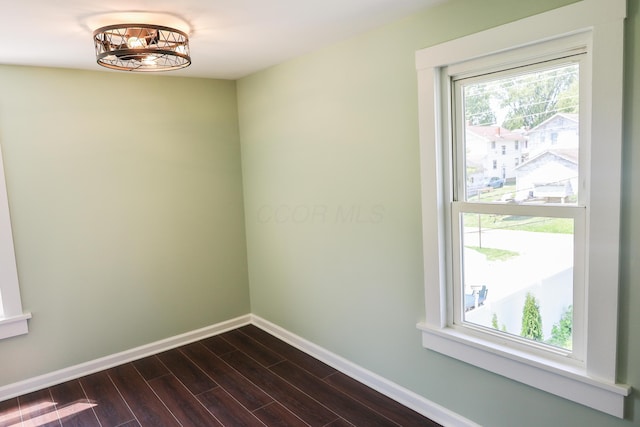 214 Moull St, Newark, OH 43055 - spare room with dark wood-style floors and a chandelier