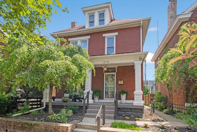 1214 Hamlet St, Columbus, OH 43201 - american foursquare style home with brick siding and a porch
