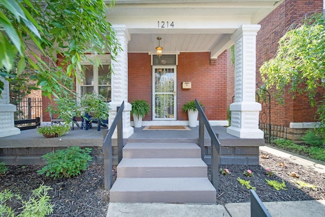 1214 Hamlet St, Columbus, OH 43201 - view of exterior entry with covered porch and brick siding