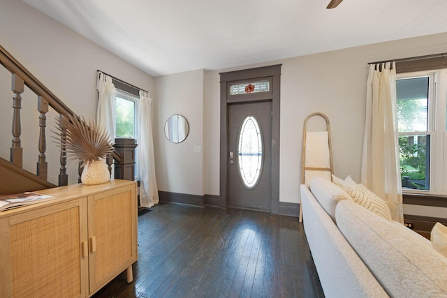 1214 Hamlet St, Columbus, OH 43201 - foyer entrance featuring dark wood finished floors, stairs, and ceiling fan