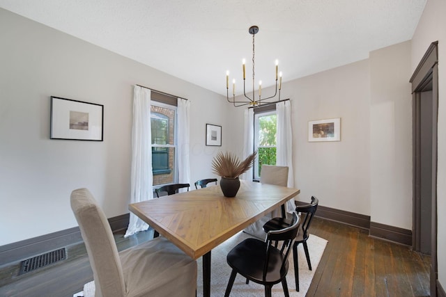 1214 Hamlet St, Columbus, OH 43201 - dining room with a chandelier and dark wood finished floors