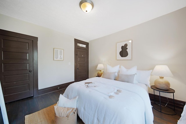1214 Hamlet St, Columbus, OH 43201 - bedroom with baseboards and dark wood finished floors
