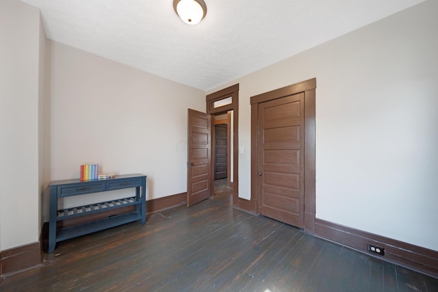 1214 Hamlet St, Columbus, OH 43201 - entrance foyer featuring dark wood-type flooring and a textured ceiling