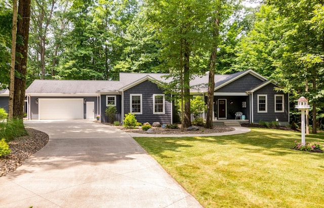 525 Floral Valley Dr W, Howard, OH 43028 - view of front facade with driveway, a front yard, an attached garage, and a porch