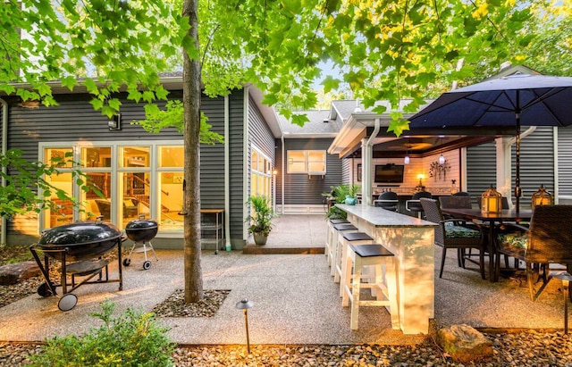 525 Floral Valley Dr W, Howard, OH 43028 - back of property featuring exterior bar and a patio area