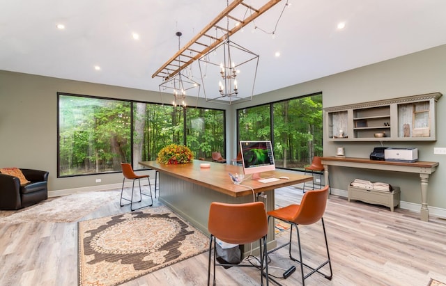 525 Floral Valley Dr W, Howard, OH 43028 - dining room featuring plenty of natural light, light wood finished floors, a chandelier, and recessed lighting