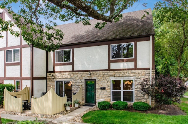 1573 Arlington Ave, Marble Cliff, OH 43212 - view of front facade featuring stone siding, roof with shingles, and stucco siding