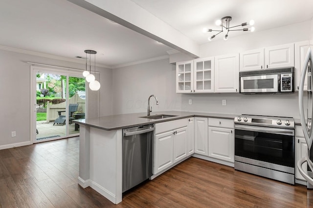 1573 Arlington Ave, Marble Cliff, OH 43212 - kitchen featuring appliances with stainless steel finishes, a sink, a chandelier, a peninsula, and white cabinets
