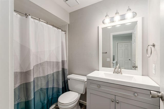 1573 Arlington Ave, Marble Cliff, OH 43212 - bathroom featuring toilet, vanity, and a shower with curtain