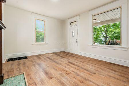 479 Siebert St, Columbus, OH 43206 - foyer entrance with wood finished floors, healthy amount of natural light, and baseboards