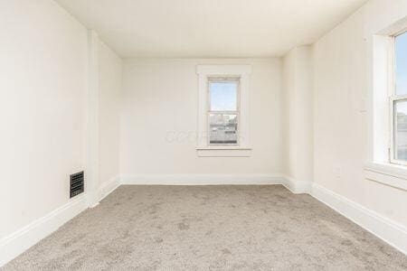 479 Siebert St, Columbus, OH 43206 - carpeted spare room with healthy amount of natural light and baseboards