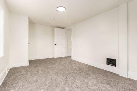 479 Siebert St, Columbus, OH 43206 - empty room featuring carpet floors and baseboards