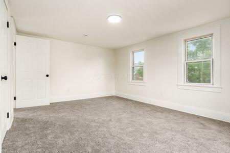 479 Siebert St, Columbus, OH 43206 - spare room with healthy amount of natural light, carpet, and baseboards