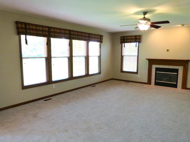 2360 Rufus Ct, Lewis Center, OH 43035 - unfurnished living room featuring a ceiling fan, a fireplace, and light carpet
