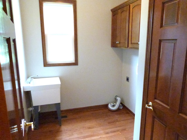 2360 Rufus Ct, Lewis Center, OH 43035 - laundry area with cabinet space, electric dryer hookup, and light wood-style floors