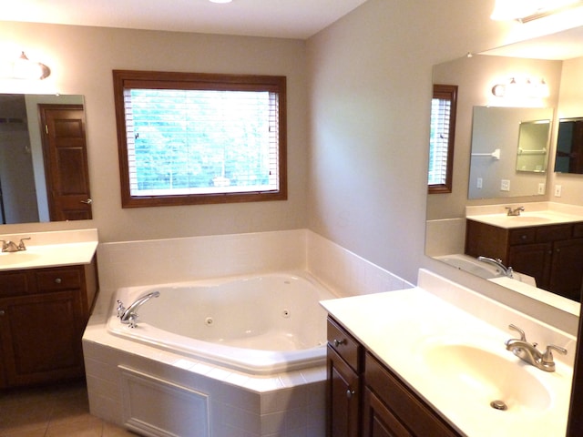 2360 Rufus Ct, Lewis Center, OH 43035 - bathroom featuring healthy amount of natural light, a tub with jets, and two vanities