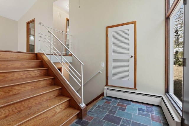 220 Hardy Way, Worthington, OH 43085 - stairs with a baseboard heating unit, stone finish flooring, and baseboards