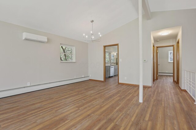 220 Hardy Way, Worthington, OH 43085 - unfurnished living room featuring an AC wall unit, baseboard heating, wood finished floors, and a chandelier