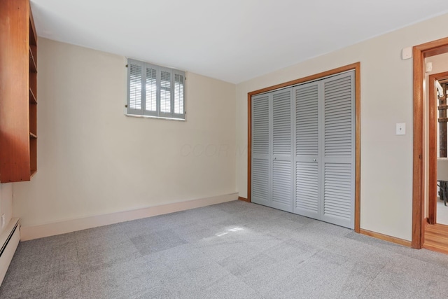 220 Hardy Way, Worthington, OH 43085 - unfurnished bedroom featuring carpet, a baseboard radiator, a closet, and baseboards