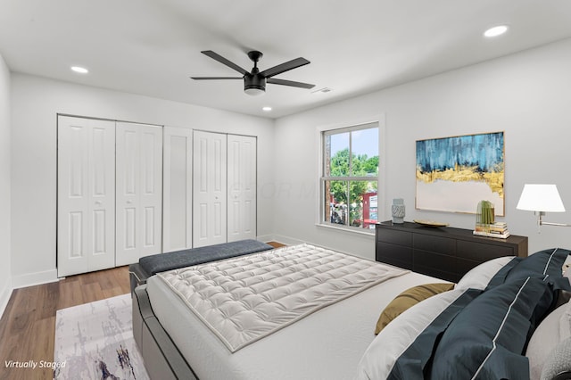 251 E Kossuth St Unit A, Columbus, OH 43206 - bedroom with two closets, wood finished floors, recessed lighting, and a ceiling fan