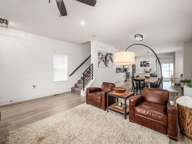 1210 Madison Ave, Columbus, OH 43205 - living area featuring light wood-style flooring, stairs, a ceiling fan, and recessed lighting
