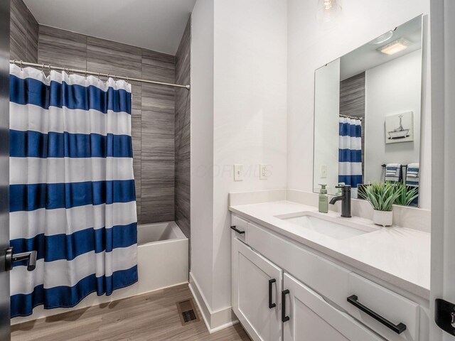 1210 Madison Ave, Columbus, OH 43205 - full bath featuring vanity, wood finished floors, and shower / bathtub combination with curtain