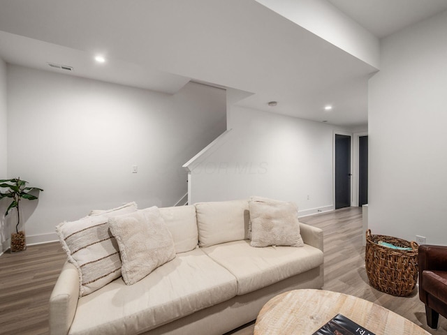 1210 Madison Ave, Columbus, OH 43205 - living room featuring recessed lighting, wood finished floors, and stairs