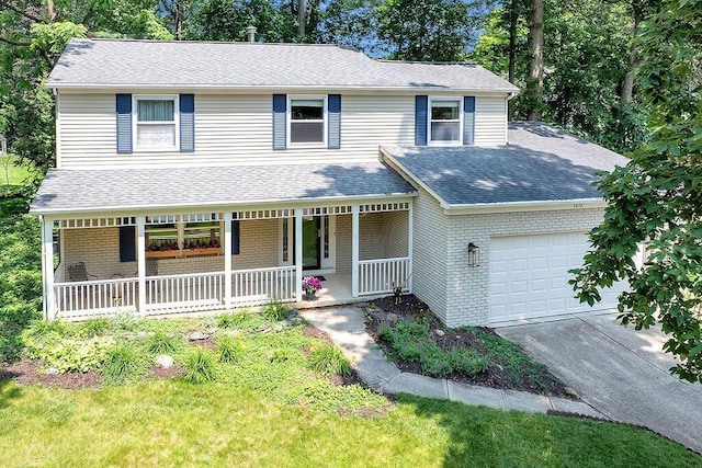 1212 Autumn Creek Cir, Westerville, OH 43081 - view of front facade with an attached garage, covered porch, driveway, a shingled roof, and brick siding