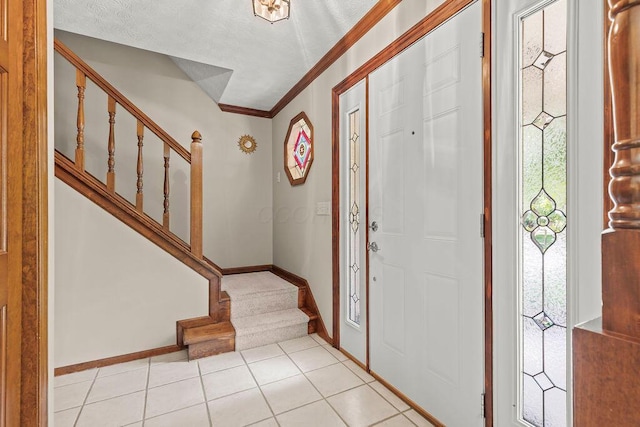 1212 Autumn Creek Cir, Westerville, OH 43081 - foyer featuring stairway, crown molding, and light tile patterned flooring