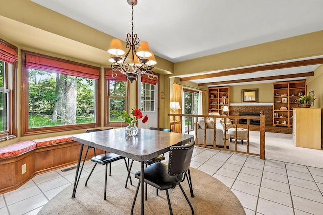 1212 Autumn Creek Cir, Westerville, OH 43081 - dining room featuring light tile patterned floors, a chandelier, and a fireplace