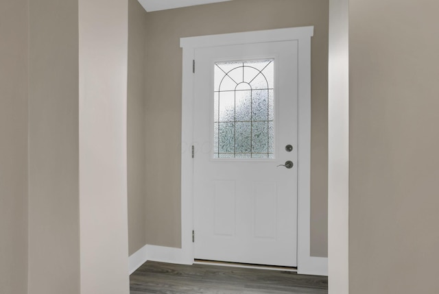 714 E 2nd St, Logan, OH 43138 - foyer entrance featuring wood finished floors and baseboards