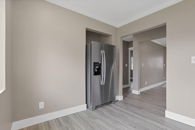 714 E 2nd St, Logan, OH 43138 - kitchen featuring stainless steel fridge, crown molding, and light wood-type flooring