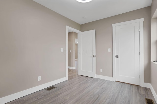 714 E 2nd St, Logan, OH 43138 - unfurnished bedroom with wood finished floors and baseboards