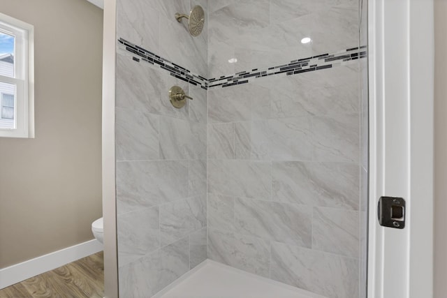 714 E 2nd St, Logan, OH 43138 - bathroom featuring a tile shower and wood finished floors