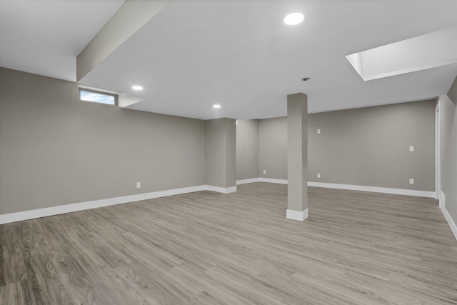 714 E 2nd St, Logan, OH 43138 - finished below grade area with light wood-style floors and recessed lighting