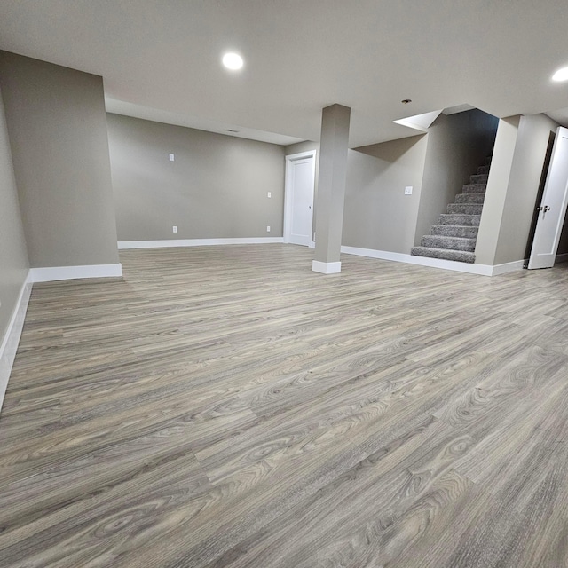 714 E 2nd St, Logan, OH 43138 - finished below grade area with stairs, wood finished floors, and recessed lighting