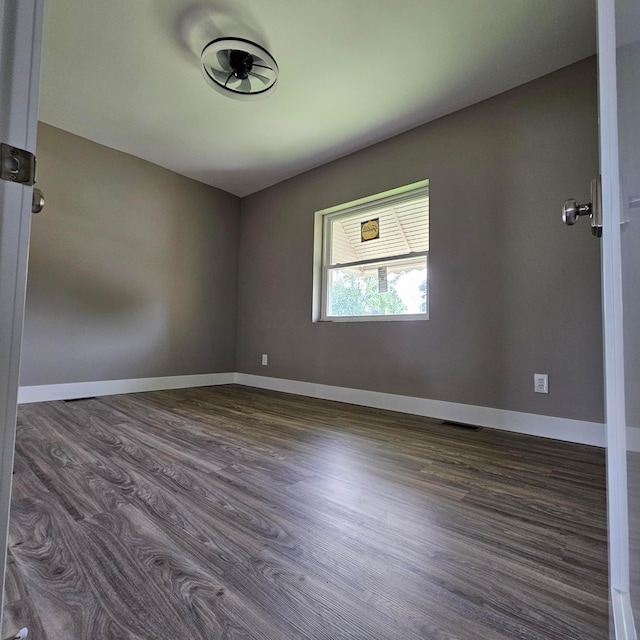 714 E 2nd St, Logan, OH 43138 - unfurnished room featuring dark wood-type flooring and baseboards