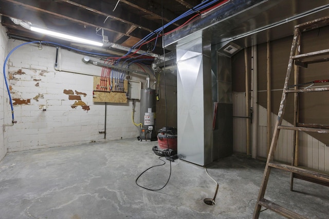 714 E 2nd St, Logan, OH 43138 - unfinished below grade area featuring gas water heater, concrete block wall, and heating unit