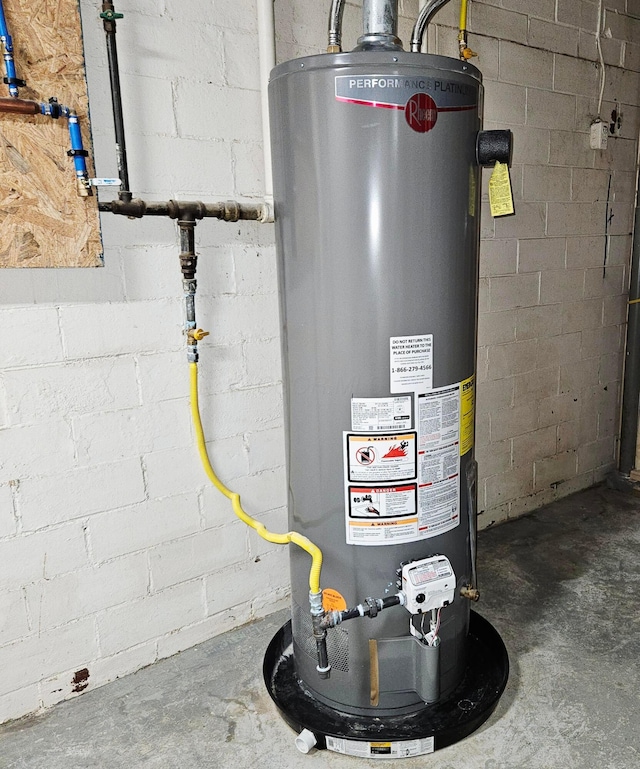 714 E 2nd St, Logan, OH 43138 - utility room featuring gas water heater
