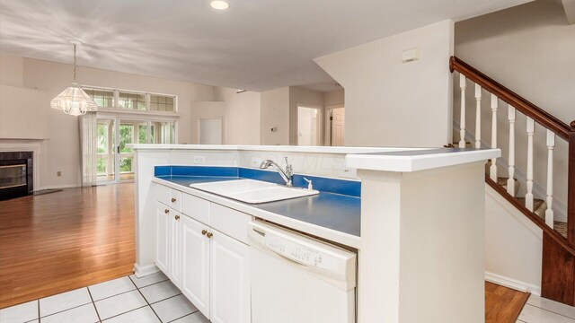 1486 Sedgefield Dr, New Albany, OH 43054 - kitchen featuring dishwasher, white cabinetry, a chandelier, light wood-type flooring, and recessed lighting