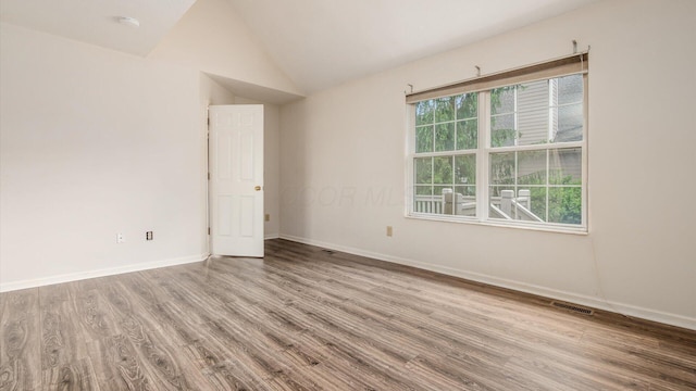 1486 Sedgefield Dr, New Albany, OH 43054 - unfurnished room with wood finished floors and vaulted ceiling