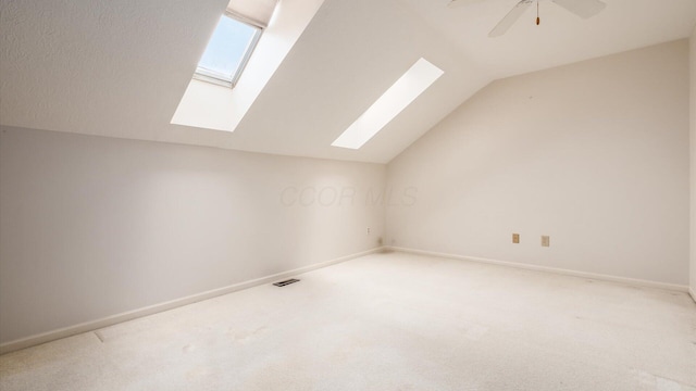 1486 Sedgefield Dr, New Albany, OH 43054 - additional living space with a skylight, vaulted ceiling, light carpet, and ceiling fan