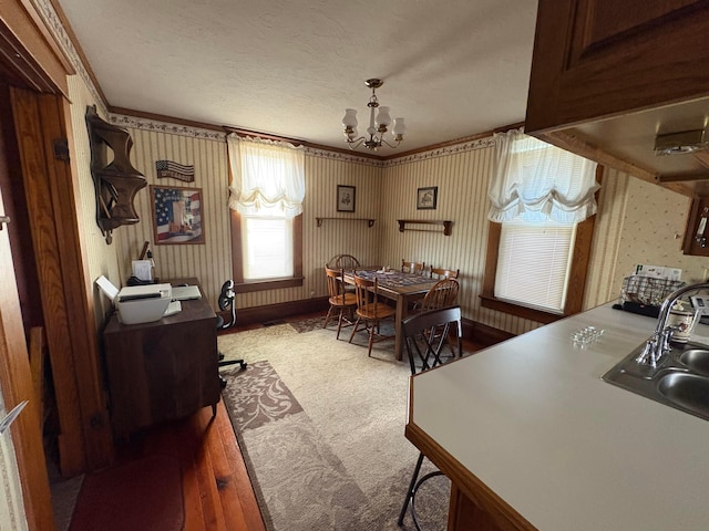 114 E N St, Mount Gilead, OH 43338 - office area featuring a chandelier, carpet floors, ornamental molding, wallpapered walls, and a textured ceiling